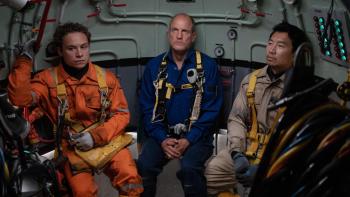 Last Breath movie: Finn Cole, Woody Harrelson, and Simu Liu look tense while sitting in a diving bell