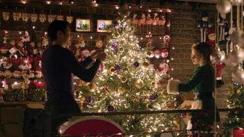 Last Christmas Movie: Kate (Emilia Clarke) and Tom (Henry Golding) decorating a Christmas tree