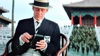 The Last Emperor Movie: Mr. Johnston sits on a chair inside the Forbidden City
