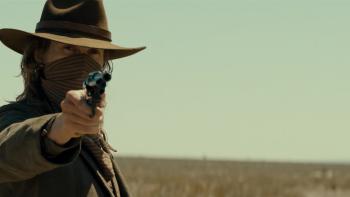 Last Train to Fortune Movie: A masked Dooley points a gun at someone