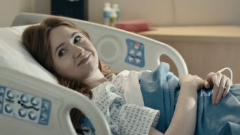 Late Bloomers movie: Karen Gillan lies in a hospital bed, smiling