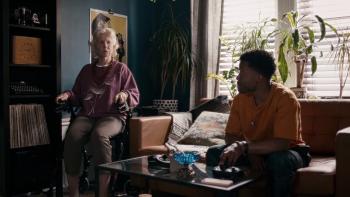 Late Bloomers movie: Malgorzata Zajaczkowska and Jermaine Fowler sit together in his living room