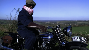 Lawrence: After Arabia: T.E. Lawrence sits on his motorcycle with his back to camera.