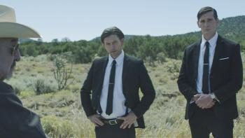 Laws of Man Movie: U.S. Marshals Tommy and Frank speak with the sheriff (Graham Greene, far left)