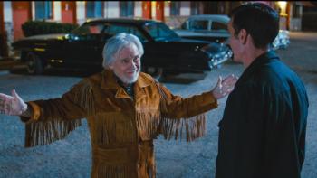 Laws of Man Movie: Preacher Cassidy Whittaker (Harvey Keitel) spreads his arms as he speaks to Frank (whose back is to viewers)