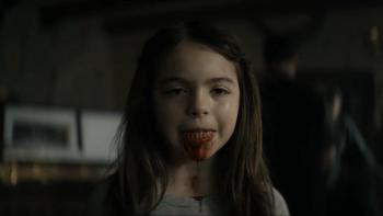 Lee Cronin's The Mummy movie: A young girl looks into the camera, blood in her mouth