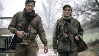 Lee movie: David (Andy Samberg) and Lee (Kate Winslet) walk with cameras while dressed in Army-issued clothes