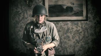 Lee movie: Lee Miller (Kate Winslet) in war fatigues, holding a twin lens reflex camera