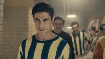 Lefter: The Story of Ordinarius movie: Turkish men soccer players in blue/yellow striped jerseys walk down hall getting ready to play a soccer match