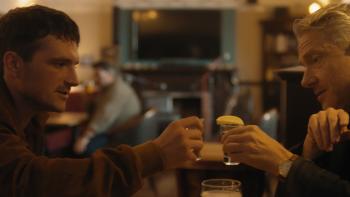 Let's Love: Josh Hutcherson and Martin Freeman clinking glasses in a cozy bar setting
