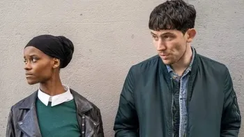 Aisha: Letitia Wright and Josh O'Connor leaning against a wall