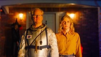 Linoleum Movie: Jim Gaffigan wears an astronaut suit while Rhea Seehorn stands next to him