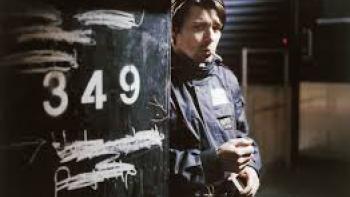 Little Siberia: man with cigarette behind pole