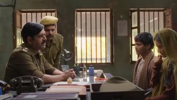 Lost Ladies: Deepak and Jaya sit at a police station and are being interrogated by an inspector