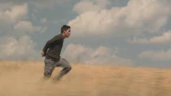 Lost in the Night:  A man walks through a field