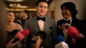 Lost in the Spotlight Movie: Man is surrounded by reporters wanting to talk to him