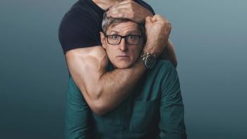 Louis Theroux — Inside the Manosphere: Louis Theroux is shown with muscular arms wrapped around his head