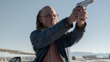 Love Lies Bleeding Movie: Ed Harris points a gun to the right