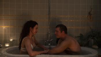 Love of Your Life movie: Margaret Qualley and Gabriel Basso smile lovingly at each other while wearing underwear in an ice bath
