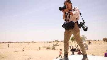 Love+War: Photojournalist Lynsey Addario takes a photograph in the desert