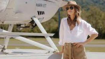 Love is in the Air:  A woman stands outside a plane