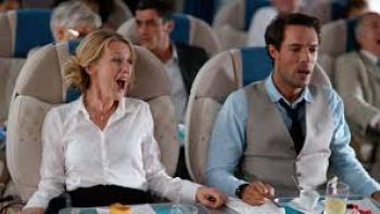 Love is in the Air: A woman and man sit on a plane