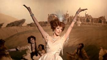 Oh! What a Lovely War: Maggie Smith holds her arms aloft as she sings onstage