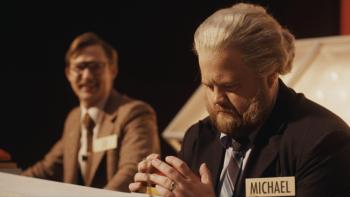 The Luckiest Man in America Movie: On the game show, Michael Larson looks down worriedly at his hands