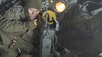 Lucky Strike Movie: Ducking in the dirt and clutching his side, Col. Castle desperately tries to raise help on the radio