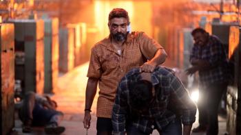 Maharaja: An Indian man leads away another man he's just overpowered