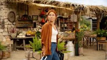 Mango: Woman walks in marketplace