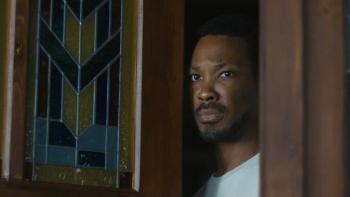 The Man in My Basement Movie: Charles Blakey opens his front door and looks concerned