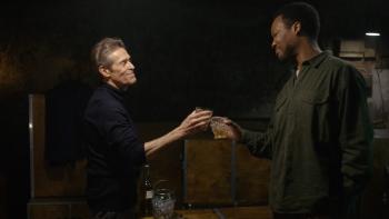 The Man in My Basement Movie: Anniston and Charles clink glasses, about to sip bourbon, on their first night