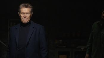 The Man in My Basement Movie: In the dark basement, Anniston looks smug, while Charles looks at him questioningly