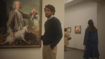 The Mastermind Movie: Standing in front of a painting in a museum, J.B. (Josh O'Connor) looks around warily
