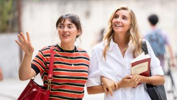 Me+You - Against the World: Two young women walking.