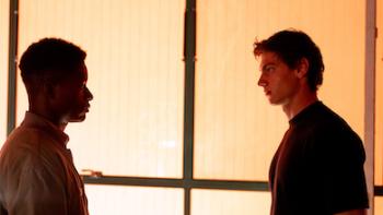 Me+You - Against the World: Shadows of two young men talking.