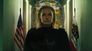 Mercy movie: Rebecca Ferguson, as an AI judge, sits at her bench in ominous lighting
