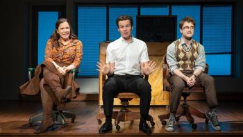 Merrily We Roll Along movie: Daniel Radcliffe, Jonathan Groff, and Lindsay Mendez sit on chairs on stage