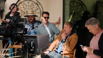 Micro Budget Movie: Director Terry is seated, fourth from the right, while various crew members surround him
