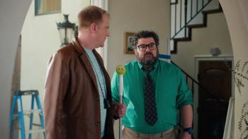 Micro Budget Movie: Director Terry stands next to effects man Rick, who holds a stick topped by a tennis ball with googly eyes