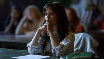 MIller's Girl movie: Jenna Ortega sits at a classroom desk, clasping her hands