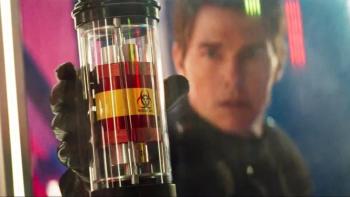 Mission: Impossible - The Final Reckoning movie: Tom Cruise holds a glass canister with a red and blue object inside