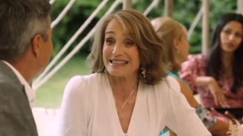 My Mother's Wedding: Kristin Scott Thomas smiles at a man who's seen from behind, in a wedding marquee