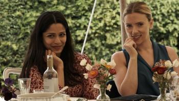 My Mother's Wedding: Freida Pinto and Scarlett Johansson sit together at a table at a wedding reception