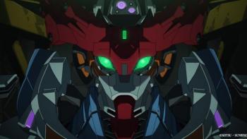 Mobile Suit Gundam GQuuuuuuX: Beginning Movie: A blue, red and grey gundam robot has lit up green eyes