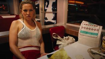 Mona Lisa and the Blood Moon: Kate Hudson sits at table