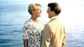 A Month by the Lake: Vanessa Redgrave and Edward Fox stand facing each other, smiling, Lake Como in the background