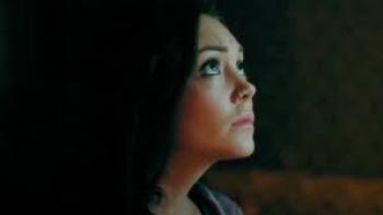 Moon Students: Mexican American woman with straight black hair center looks up to the sky at night