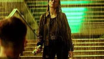 Mother's Day: woman stands in the rain with grocery bags